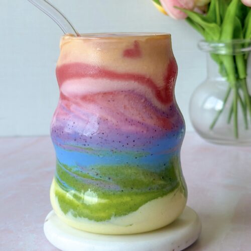 hero image of finished and swirled layered rainbow smoothie thats all natural and dye free