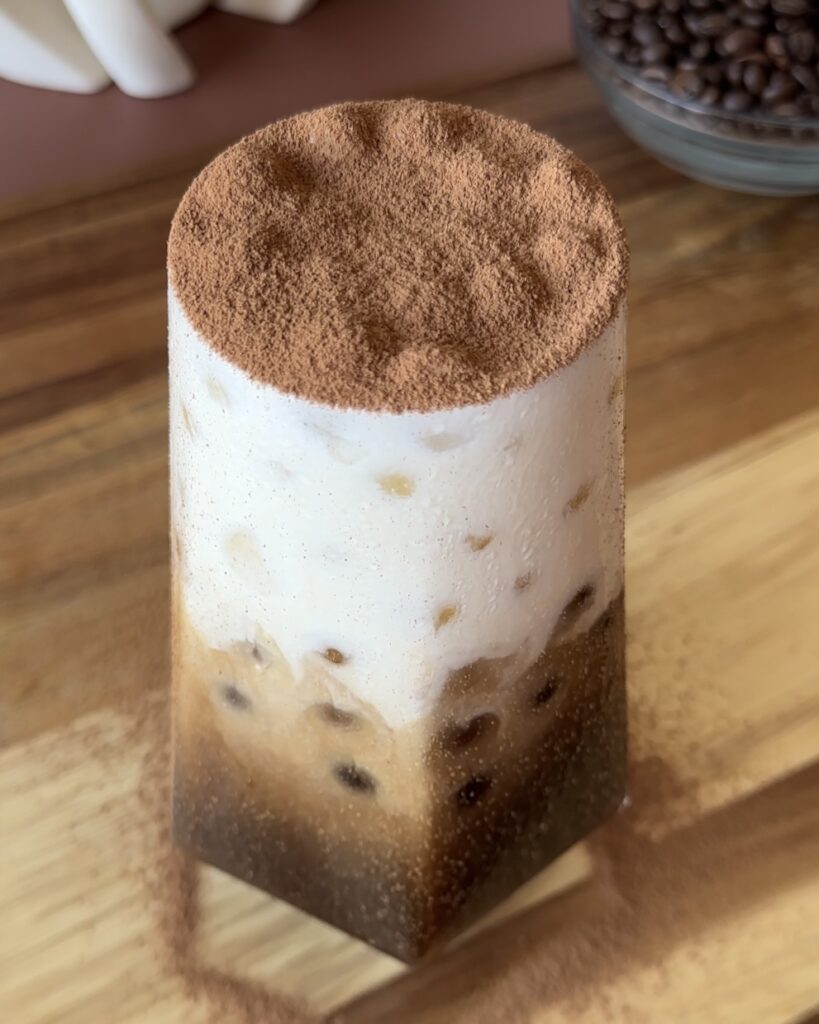 finished tiramisu cold brew iced coffee with dark chocolate, coffee and mascarpone cold foam
