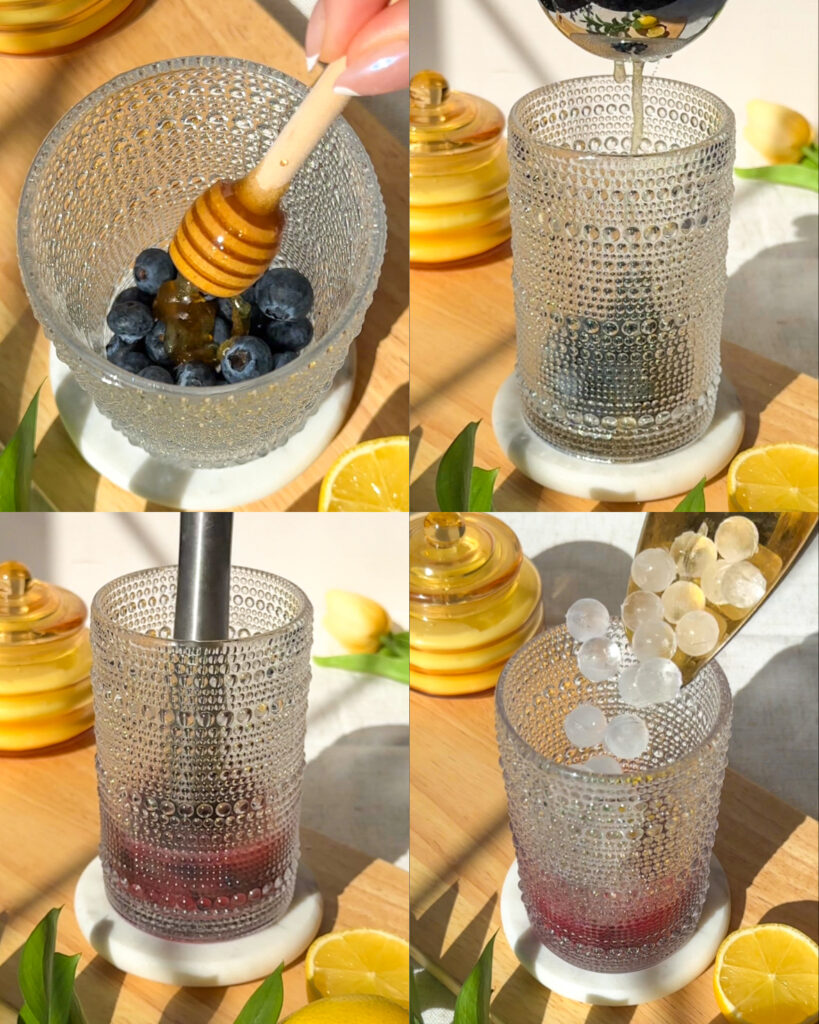 Step-by-step process of making a blueberry hydration drink by adding honey, lemon juice, muddling blueberries, and filling the glass with ice.